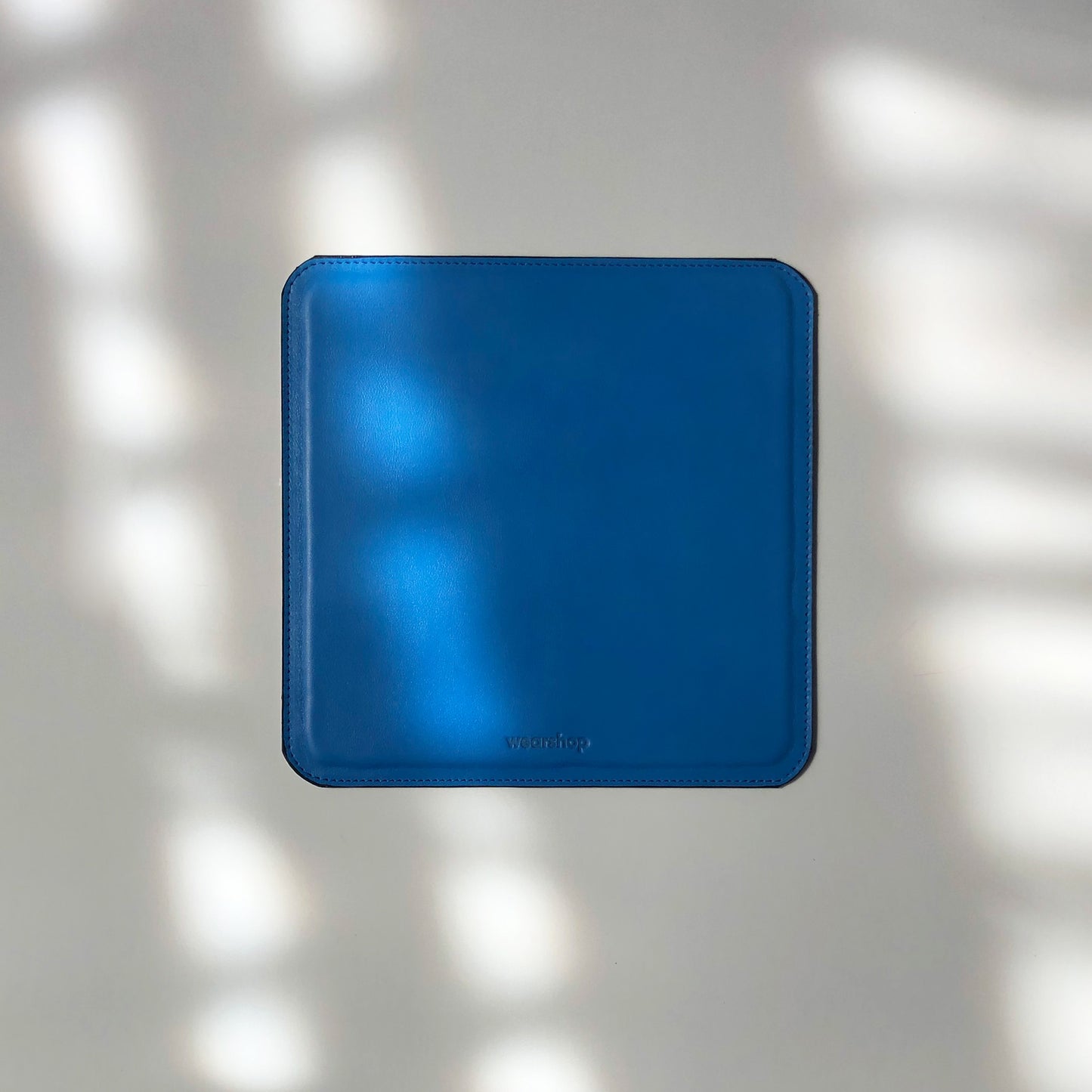 Italian leather mouse pad in bright blue colour. Made in Canada.